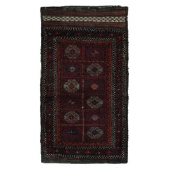 Tapis persan Baluch vintage à motifs polychromes de Rug & Kilim