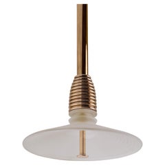 The Insulator 'B' Pendant in polished brass and frosted glass by NOVOCASTRIAN
