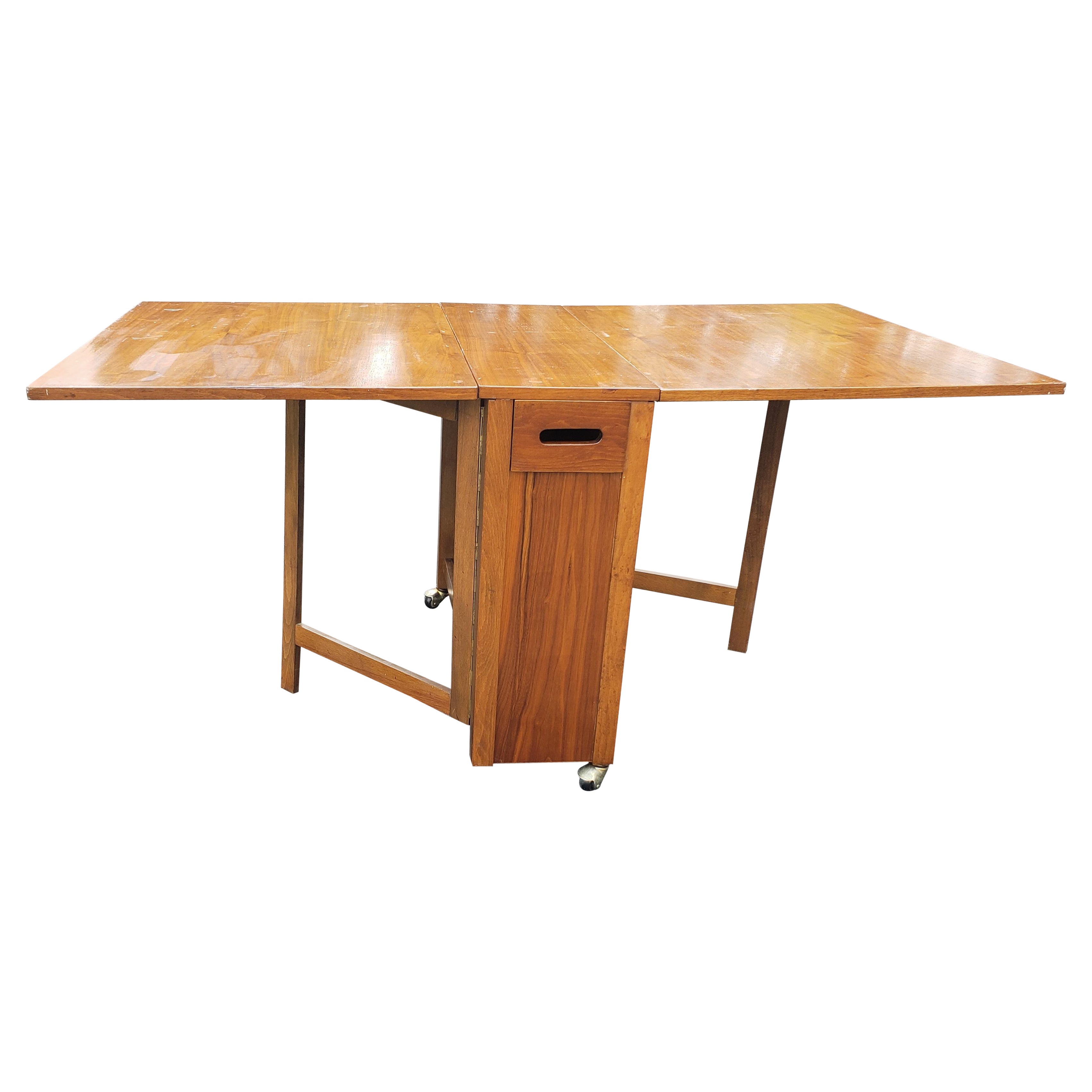 Mid-Century Danish Modern Teak Drop-Leaf Dining Table with Storage on Rollers For Sale