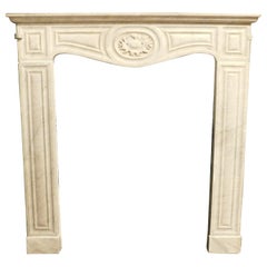 Fireplace mantle  thin frame, carved in white Carrara marble, Italy