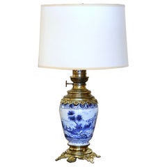 Used 19th Century French Delft Blue and White Painted Porcelain and Brass Oil Lamp