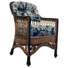 An Antique Hand Woven Natural Finish Bar Harbor Style Arm Chair With Blue Trim