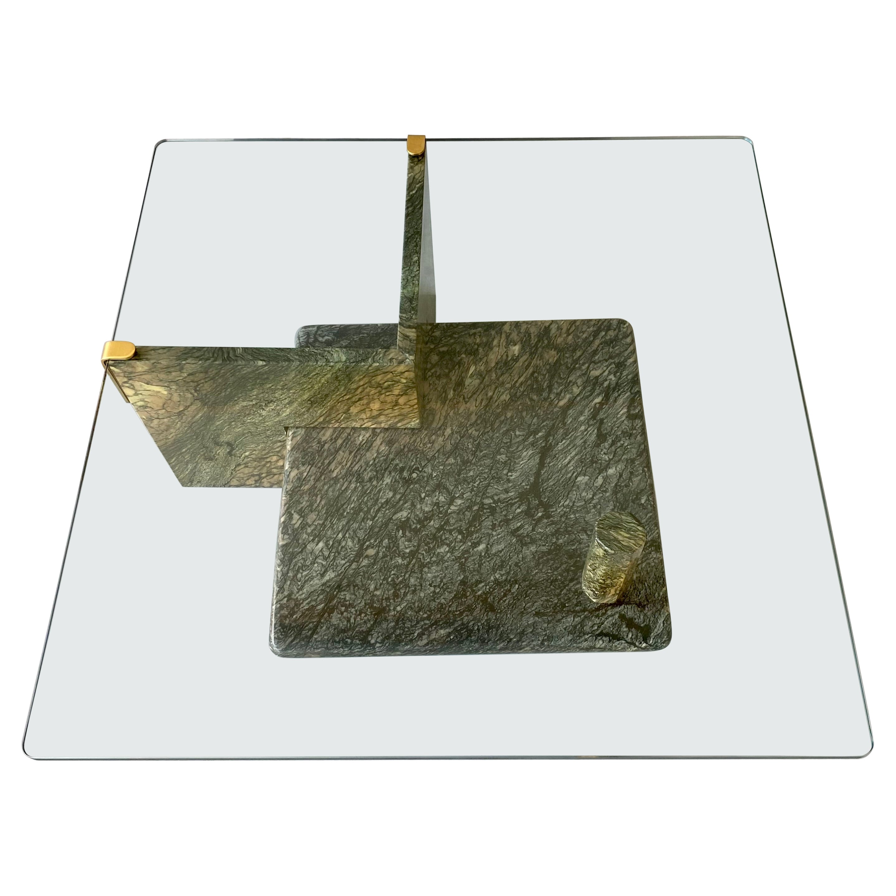 Introducing the epitome of timeless elegance - the Vintage Sicilian Green Square Marble Coffee Table with Glass Top. Crafted in Italy in 1980, this exquisite piece showcases the perfect blend of sophistication and functionality.

With its