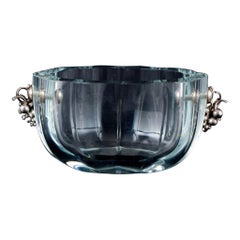 Danish glass artist. Bowl in clear glass with a handle in the shape of grapes.