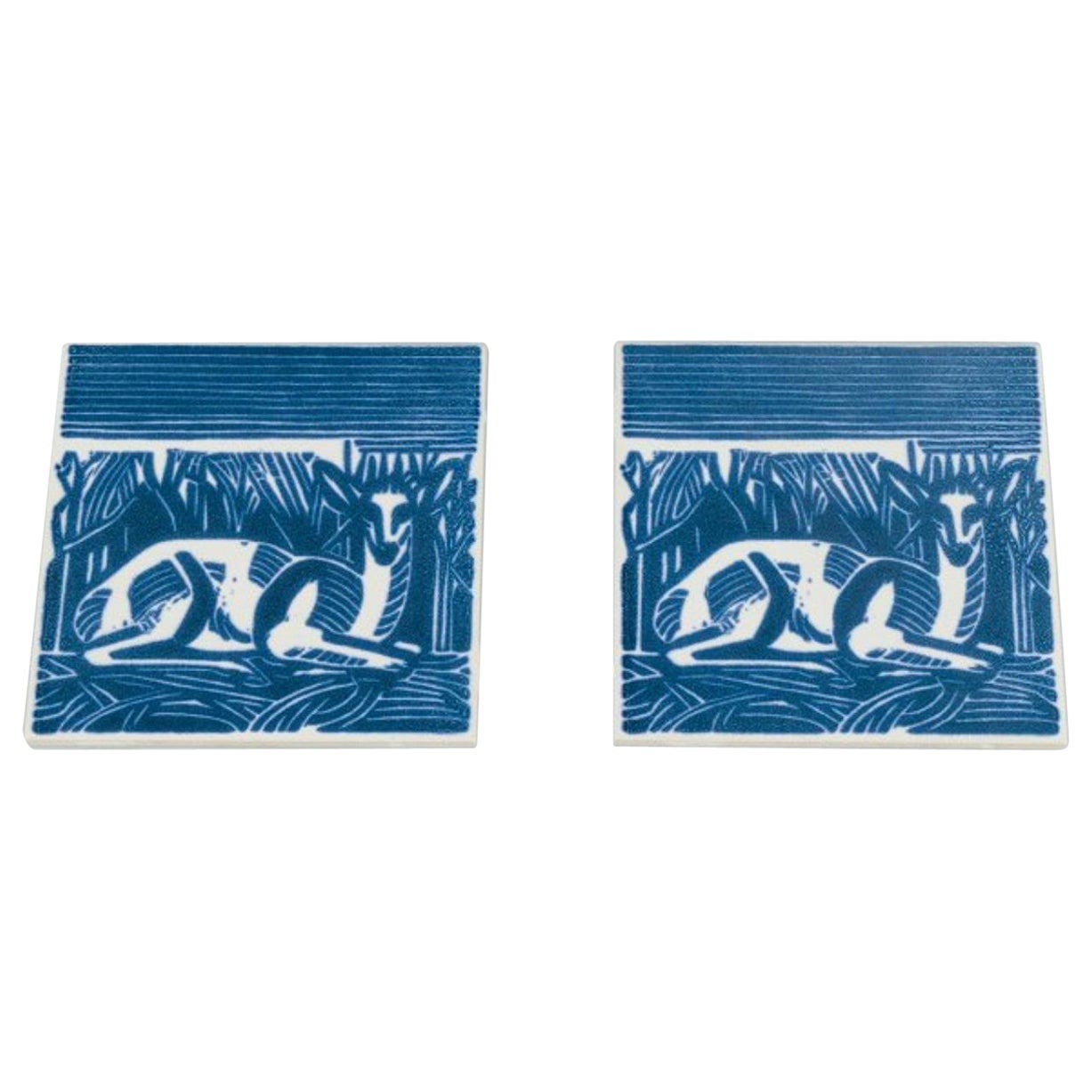 Axel Salto for Royal Copenhagen. Two rare tiles with a motif of reclining deer. For Sale