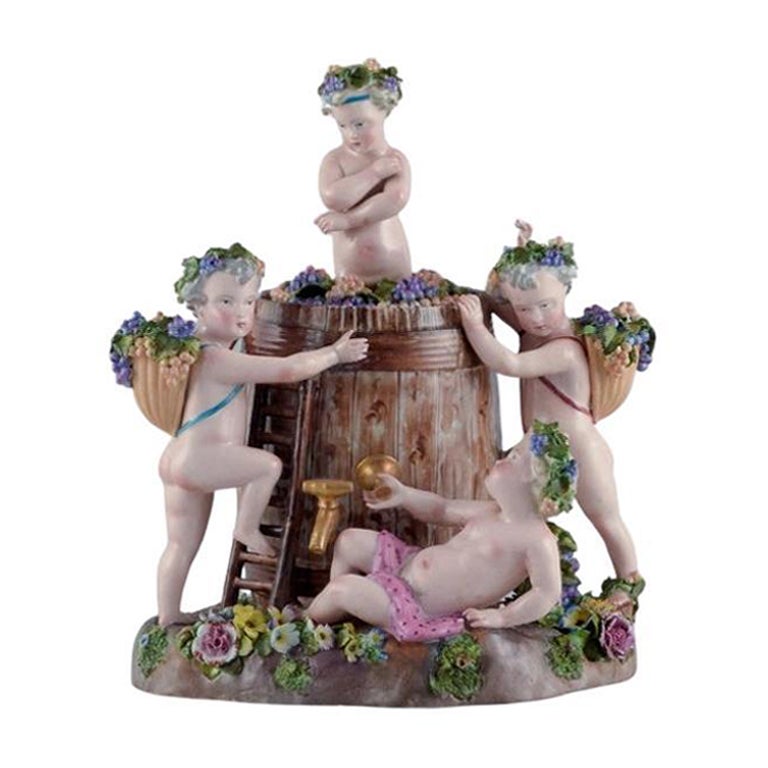 Large European antique porcelain figure group.  Bacchanalia with putti.