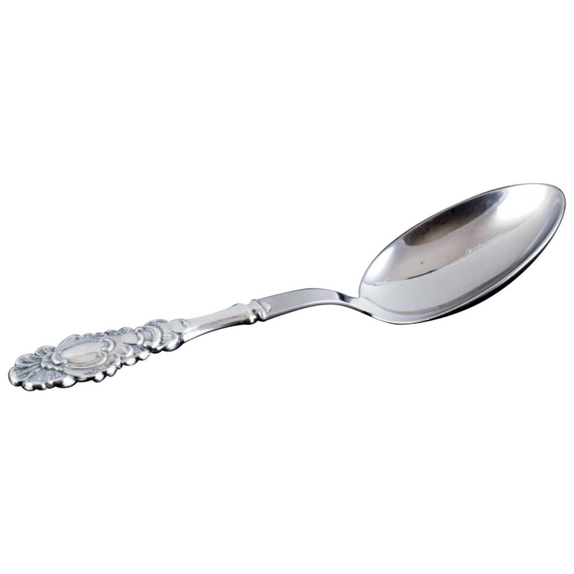 Danish silversmith. Serving spoon in Danish 830 silver and stainless steel. For Sale