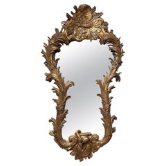 An Unusual Large Carved Giltwood Wall Mirror
