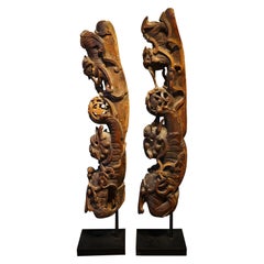Pair of Indonesian woodcarvings with foodogs, Qilin, 19th century