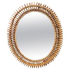 An oval Italian 1970s mirror by Franco Albini with thick, hand woven frame