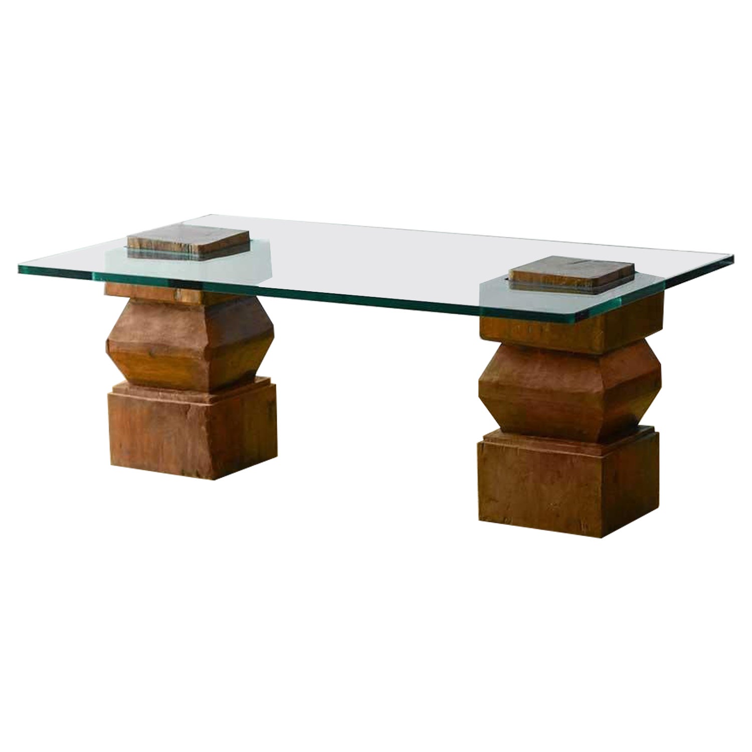 Coffee table with wooden bases and glass top For Sale