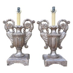 Coppia di lampade in legno dorato in argento del XVIII secolo