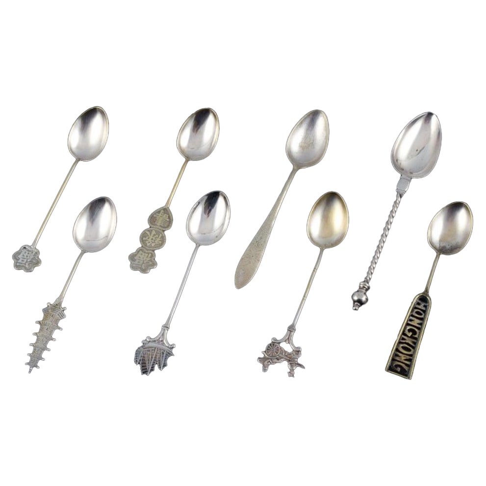 Hong Kong silver, eight spoons with different motifs. 1930/40s. For Sale