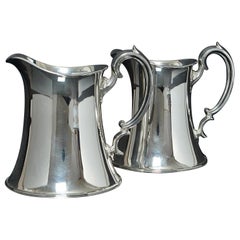 Vintage Pair of Arts & Crafts silver water jugs