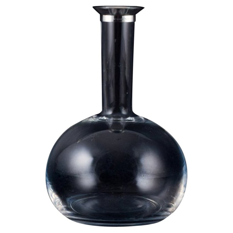 Ole Palsby for Georg Jensen, wine decanter in clear glass and sterling silver. 
