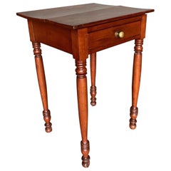 Used 19th Century American cherry one drawer stand with turned legs and feet 