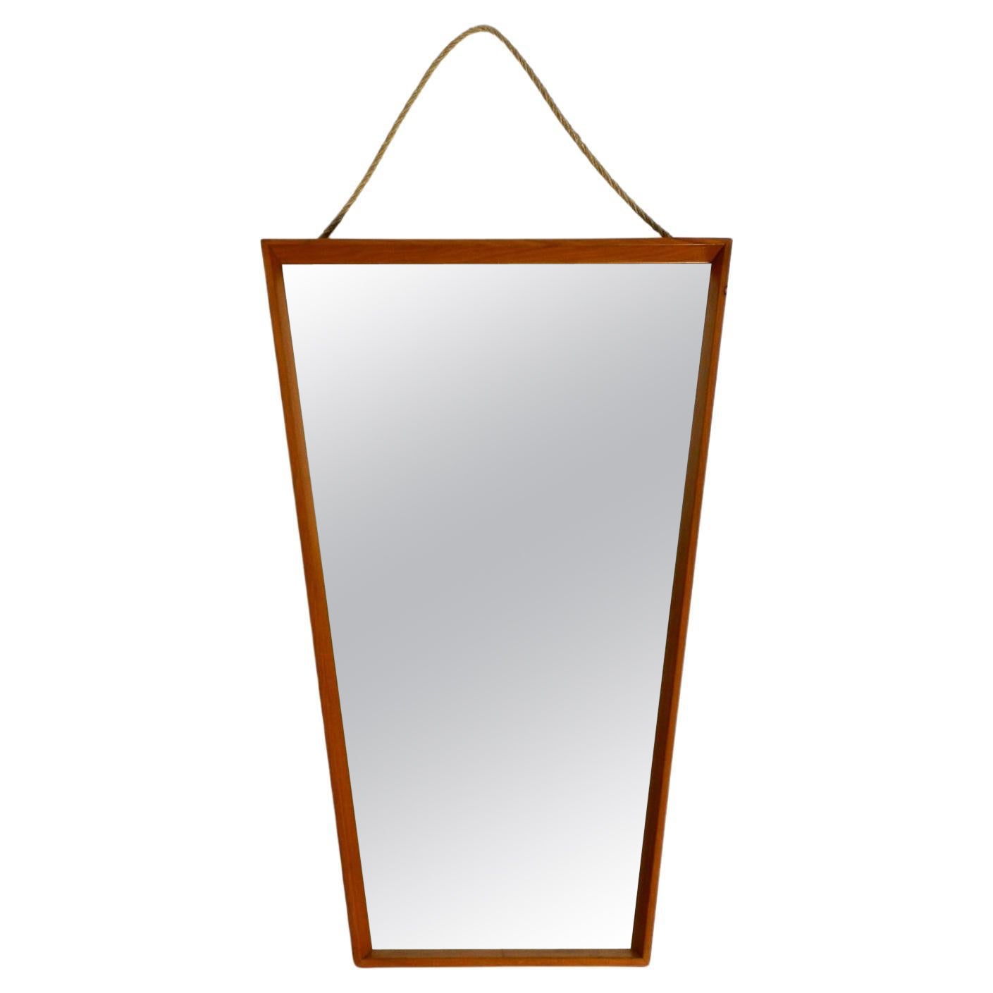 Large 1950s wall mirror in trapezoidal shape with a solid cherry wood frame For Sale