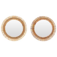 A pair of Vittorio Bonacina split cane bamboo mirrors with bamboo hanging chains