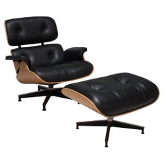 Eames Oiled Walnut & Black Leather Lounge Chair & Ottoman by Herman Miller