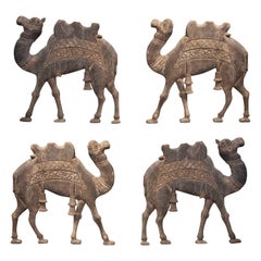 Set of Four Wooden Reliefs of Hand-Carved Camels