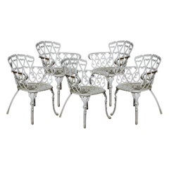 Set of five cast iron Coalbrookdale style garden chairs