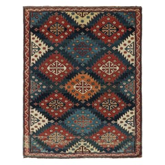 Tapis caucasien ancien Kazak à motifs tribaux rouges et bleus de Rug & Kilim