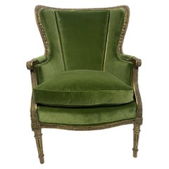 Bergère/ fauteuil de style Louis XVI en bois sculpté et velours vert