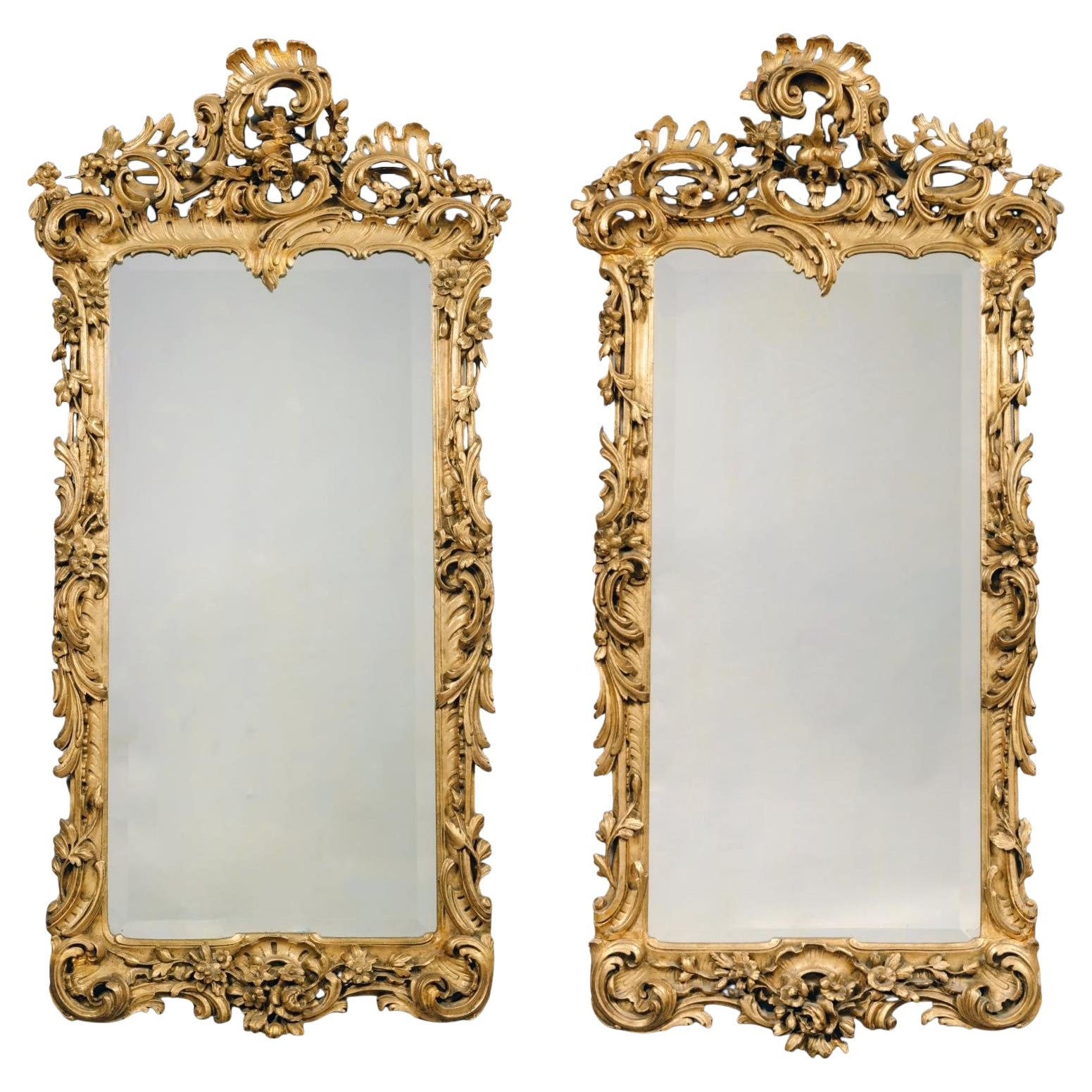 A Fine Pair of George III Style Carved Giltwood Mirrors For Sale