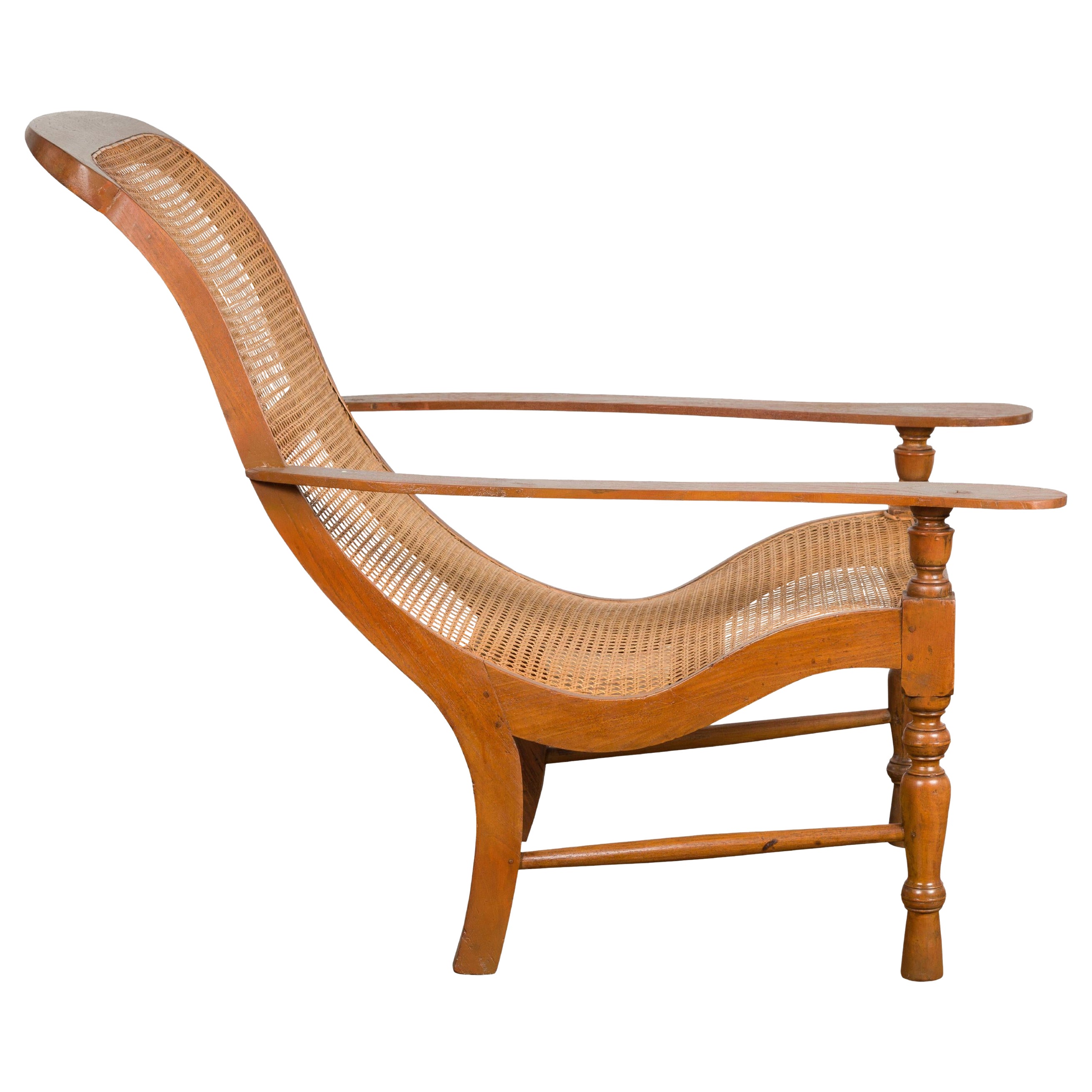 Antique Lounge Chair with Curved Seat and Extended Back