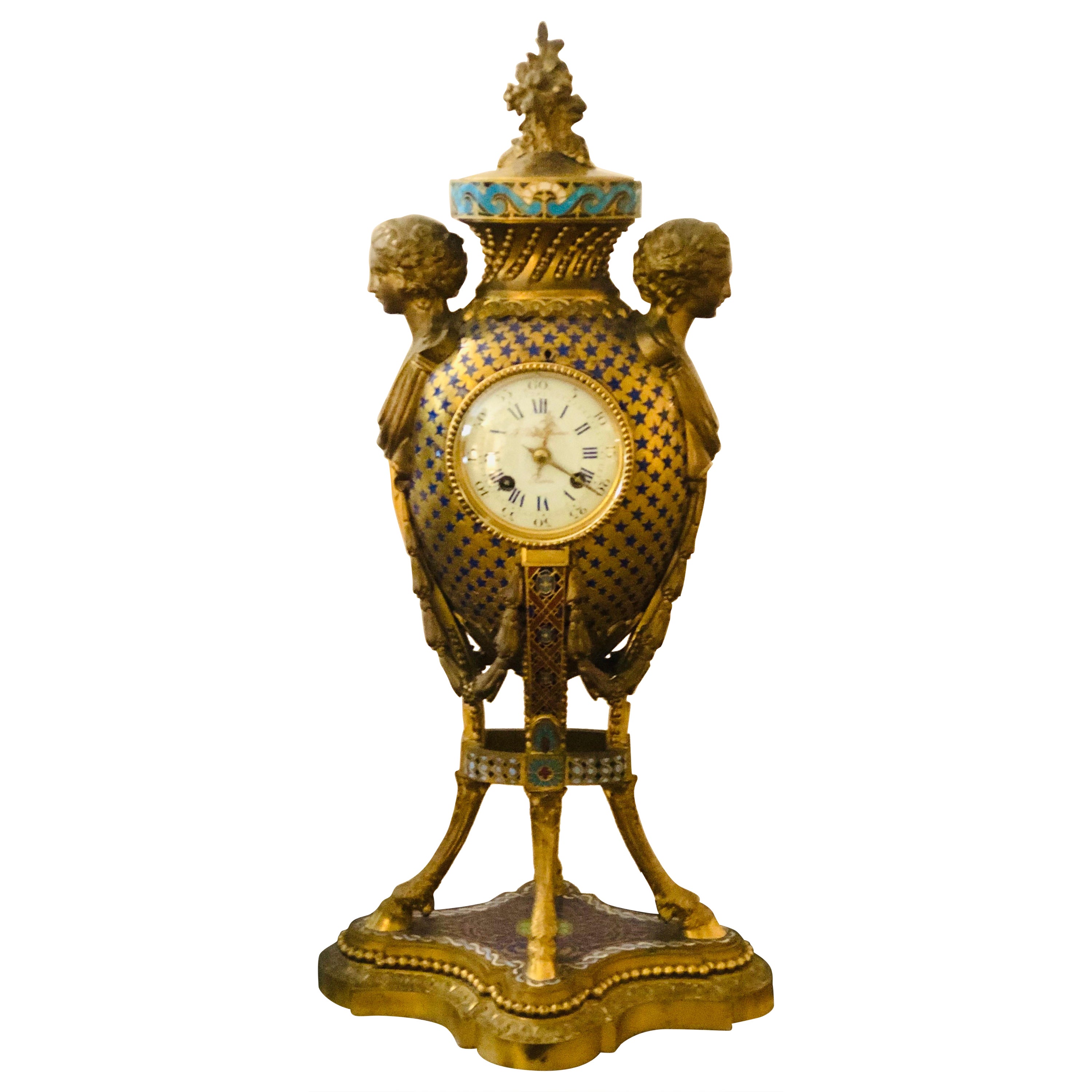 Pariser Barbedienne-Uhr aus Bronze und Emaille mit figuralen Damengesichtern und Hufeisenfüßen