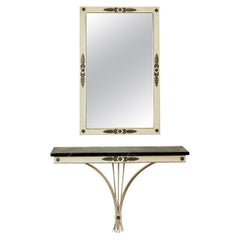 Wall mirror and console set, lacquered iron and gilded brass, circa 1950.