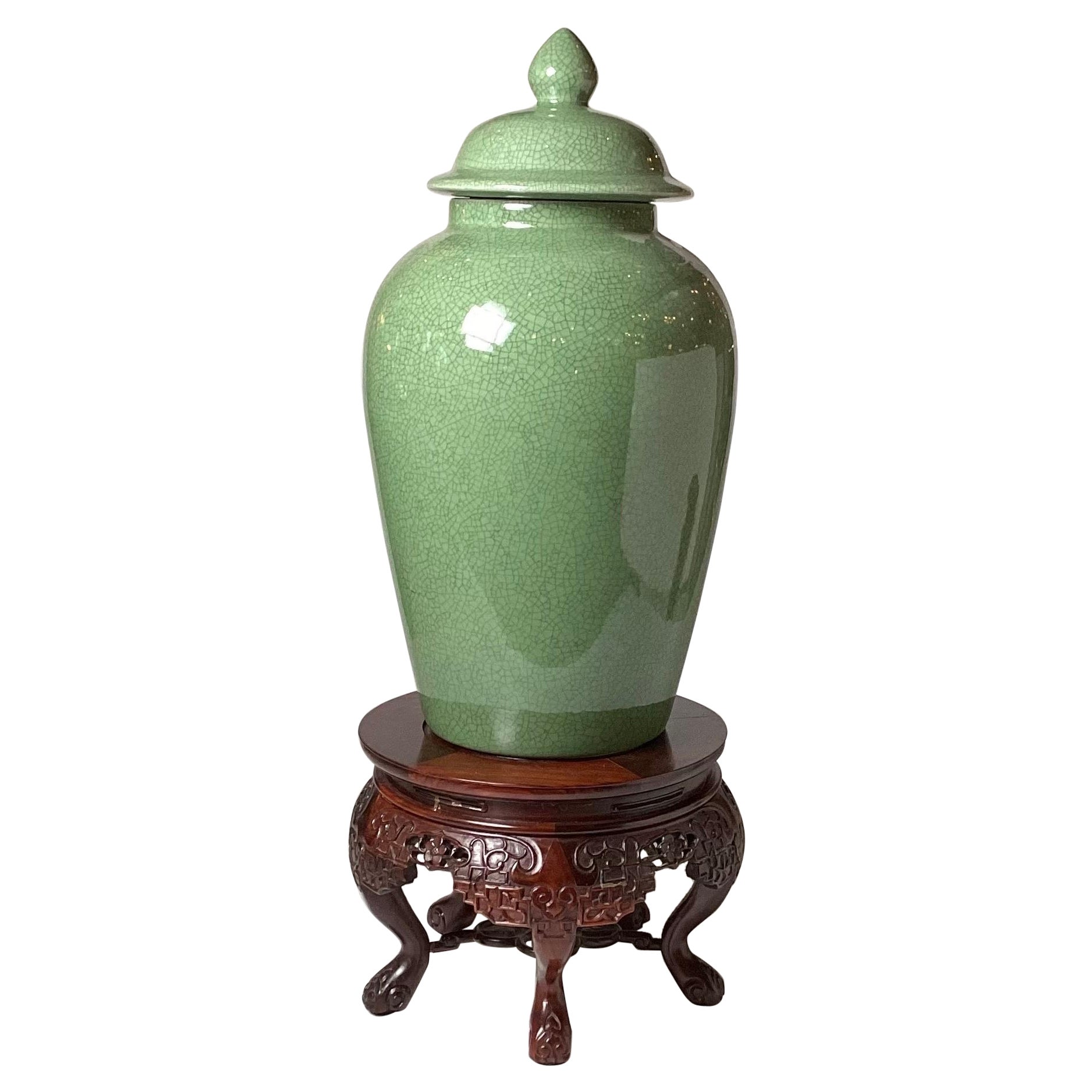 A Chinese Porcelain Temple Jar with Hand Carved Stand