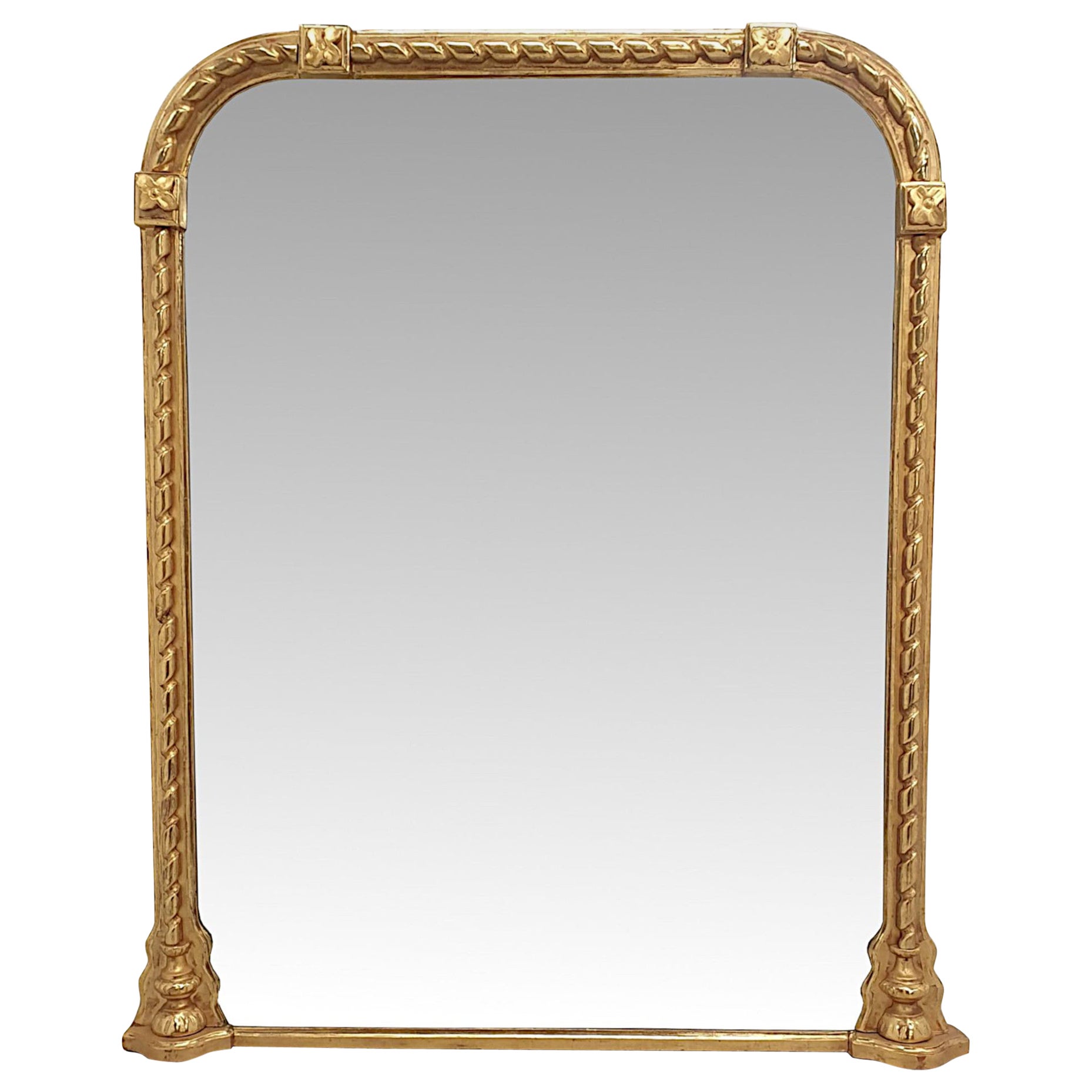 Fabuleux miroir surmonté d'un manteau du 19ème siècle avec détails en forme de ruban torsadé en vente
