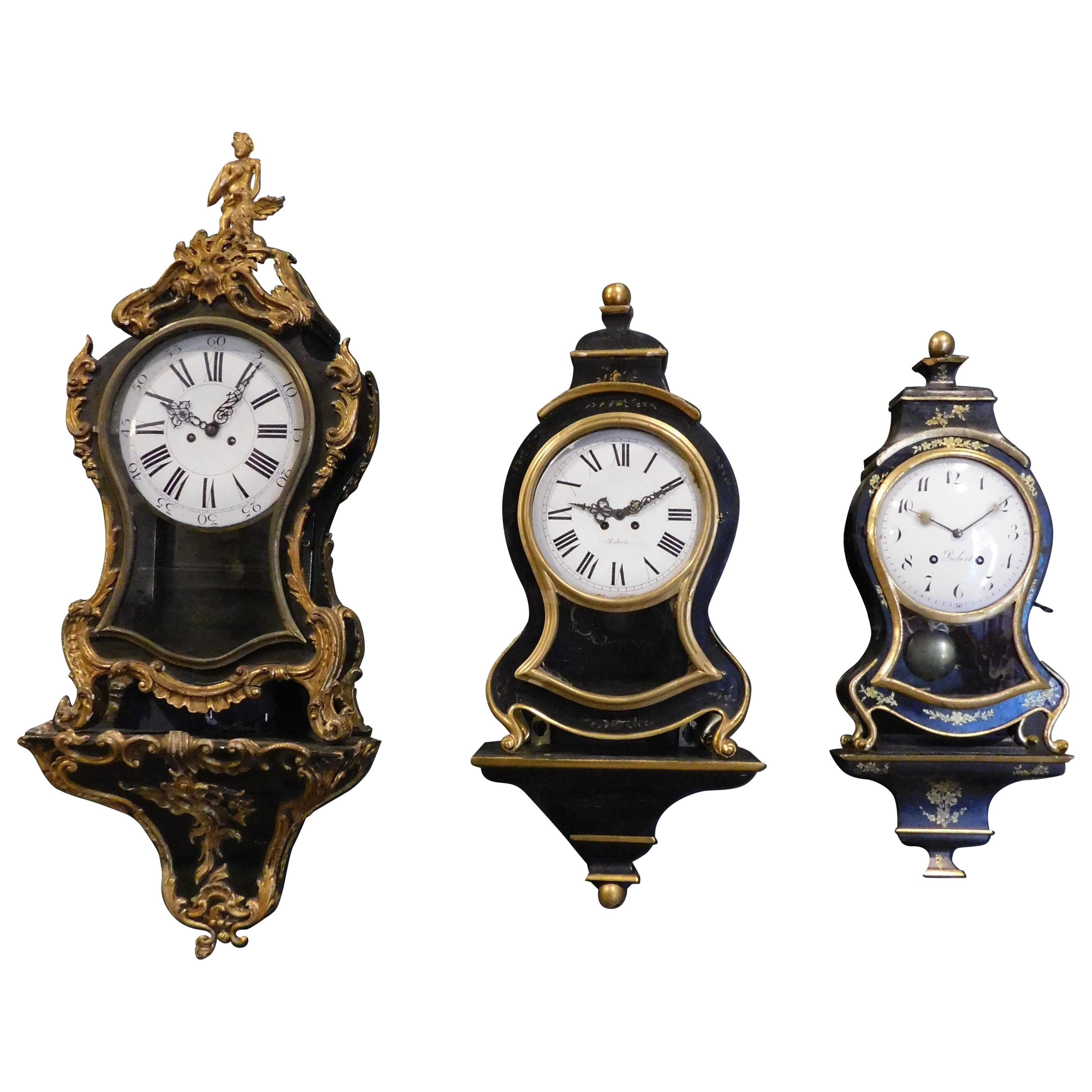 set n.3 clocks ebonized wood, profiles and feet decorated gilded plant motifs For Sale