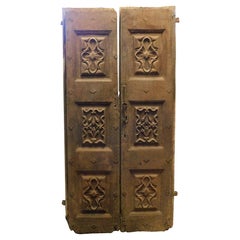 Richly carved solid walnut entrance double door, Italy