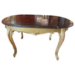 Antique Louis XVI-style gilt wood and  rouge griotte marble top center table