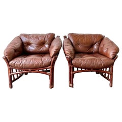 Leather and rattan lounge chairs in the style of Percival Lafer 