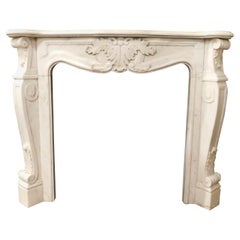 Fireplace mantle in white Carrara marble, carved with shell, Italy