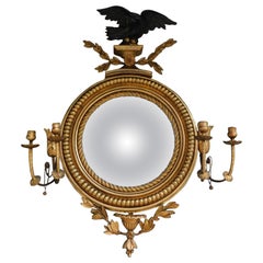 Miroir convexe à feuillage en bois d'aigle doré et ébénisé Girandole de style fédéral américain, vers 1800