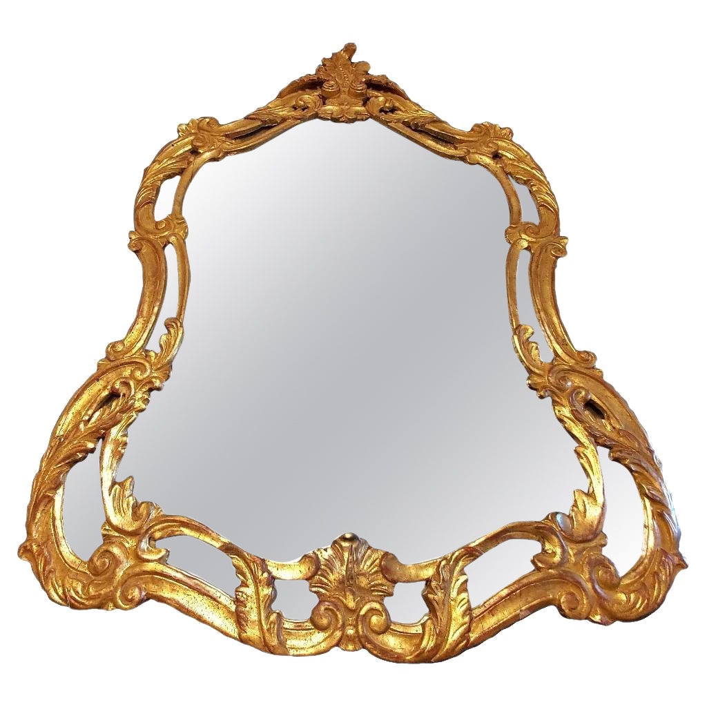 Miroir de style baroque italien du milieu du 19e siècle en bois doré sculpté à l'or fin