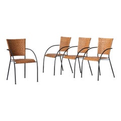 Set of 4 stackable dining chairs in steel and rattan, 1970s