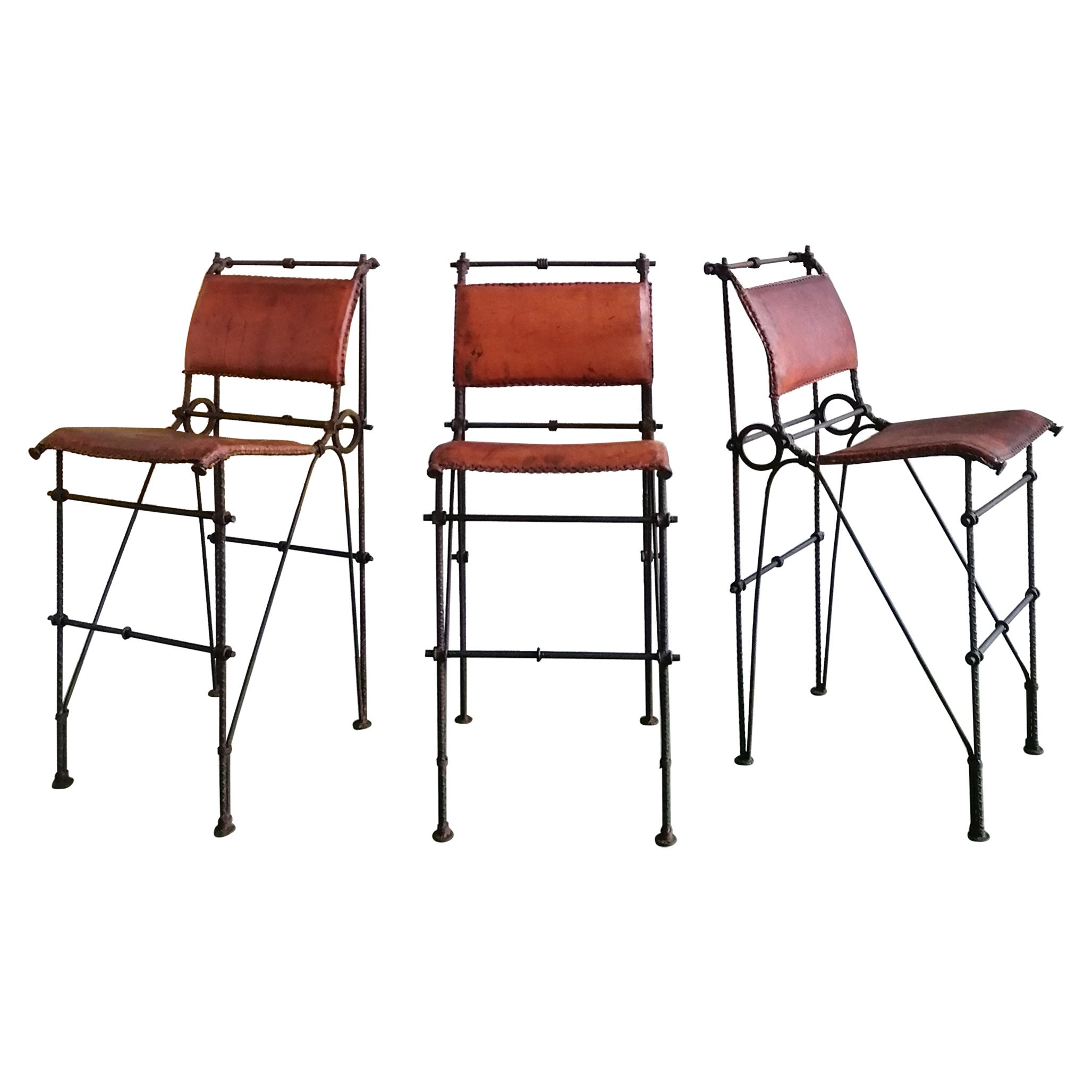 Brutalist iron & hide leather bar stools by Ilana Goor, 1970s. Three available For Sale