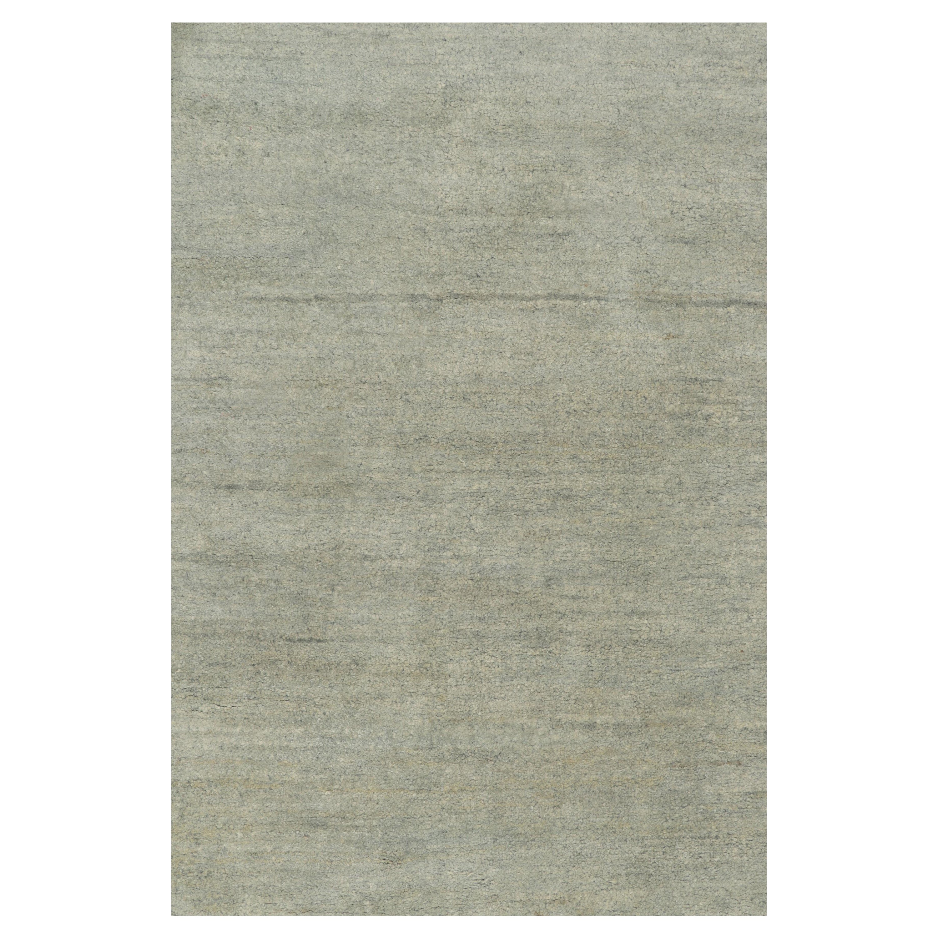 Hand knotted in a fine blend of wool & silk, a scintillating 8x10 design from Rug & Kilim’s Texture of Color Collection. A delicious blend of luxurious silver-gray and blue striae, accented by a subtle sheen naturally complimenting the textural