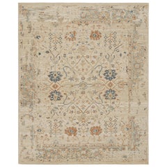 Alfombra de estilo Oushak de Rug & Kilim con motivos florales en beige, óxido y azul marino