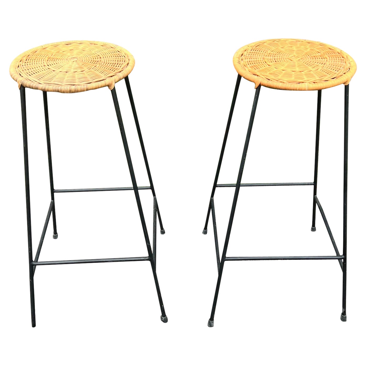 A pair of 1950’s Danny Ho Fong Style Counter Height Bar Stools in iron and wicke