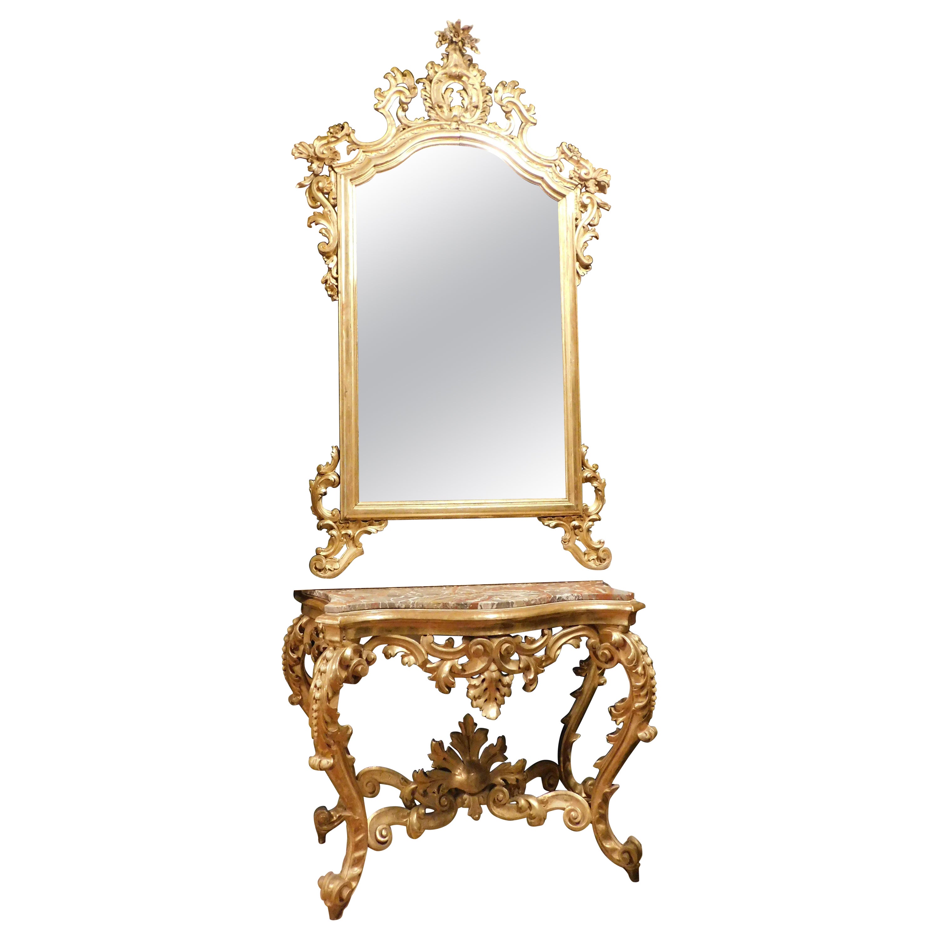 Console mirror in gilded wood carved floral decorations, red marble top, Naples For Sale
