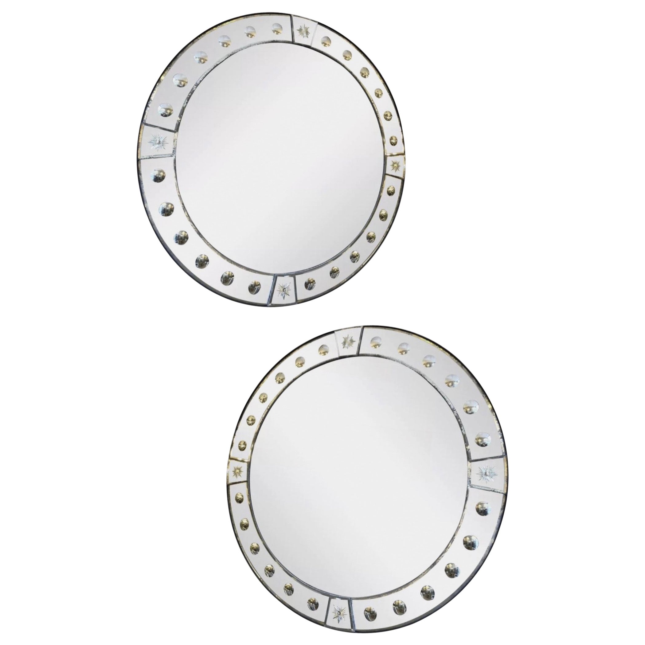 A Pair Of Circular Panelled Distressed Glass Mirrors