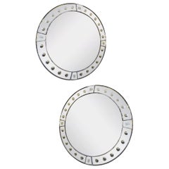 A Pair Of Circular Panelled Distressed Glass Mirrors 