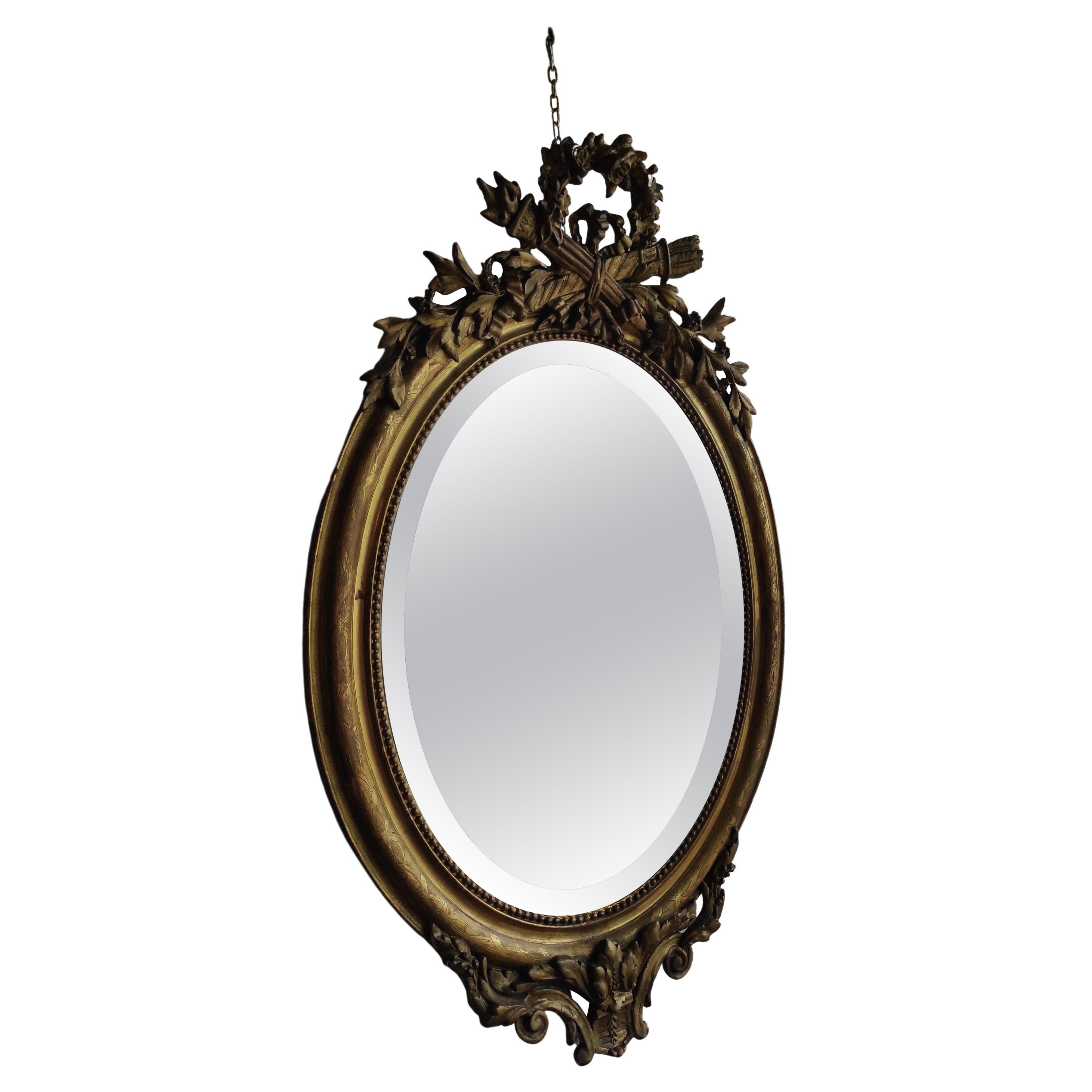 Golden oval mirror For Sale