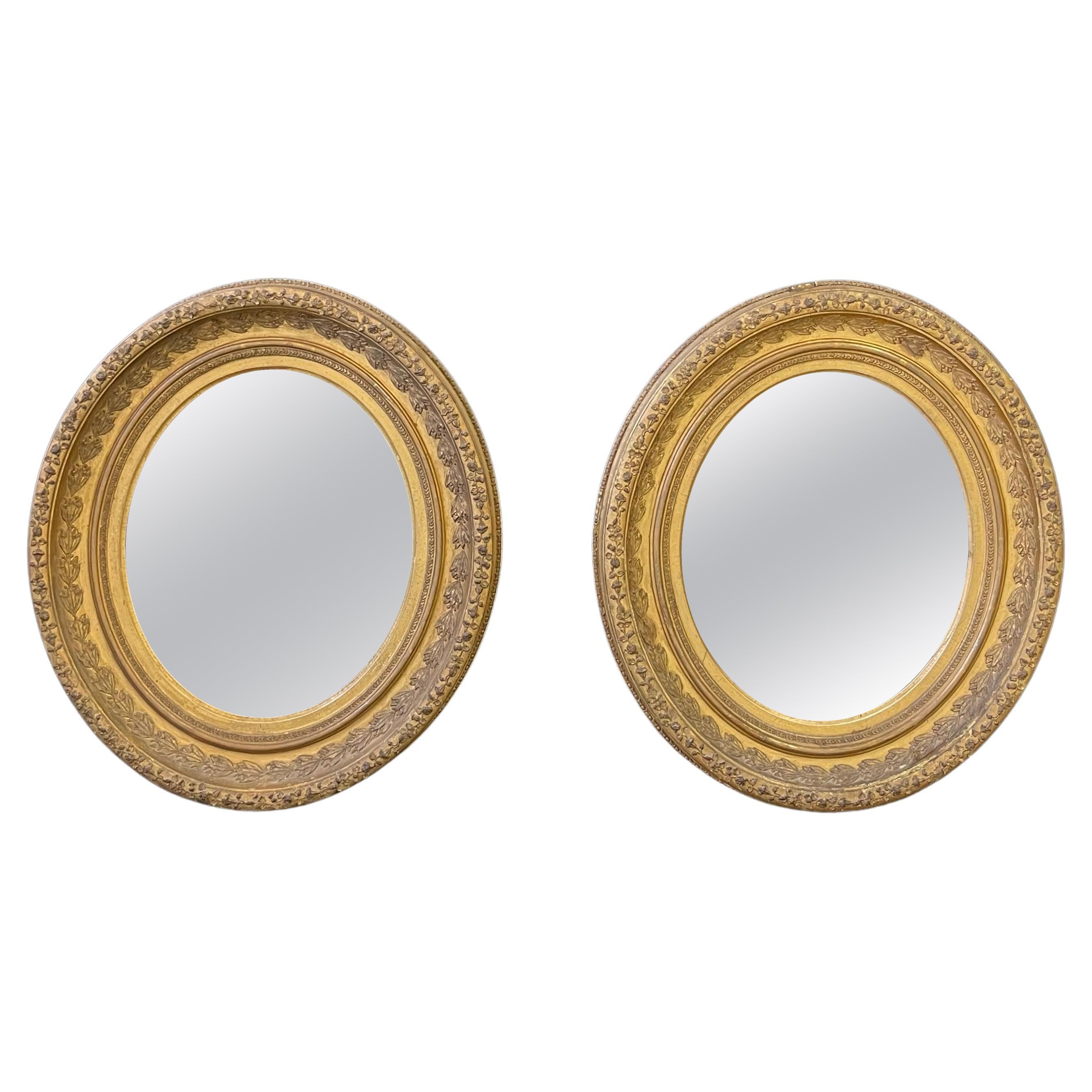Pair of English Oval Gilt Mirrors
